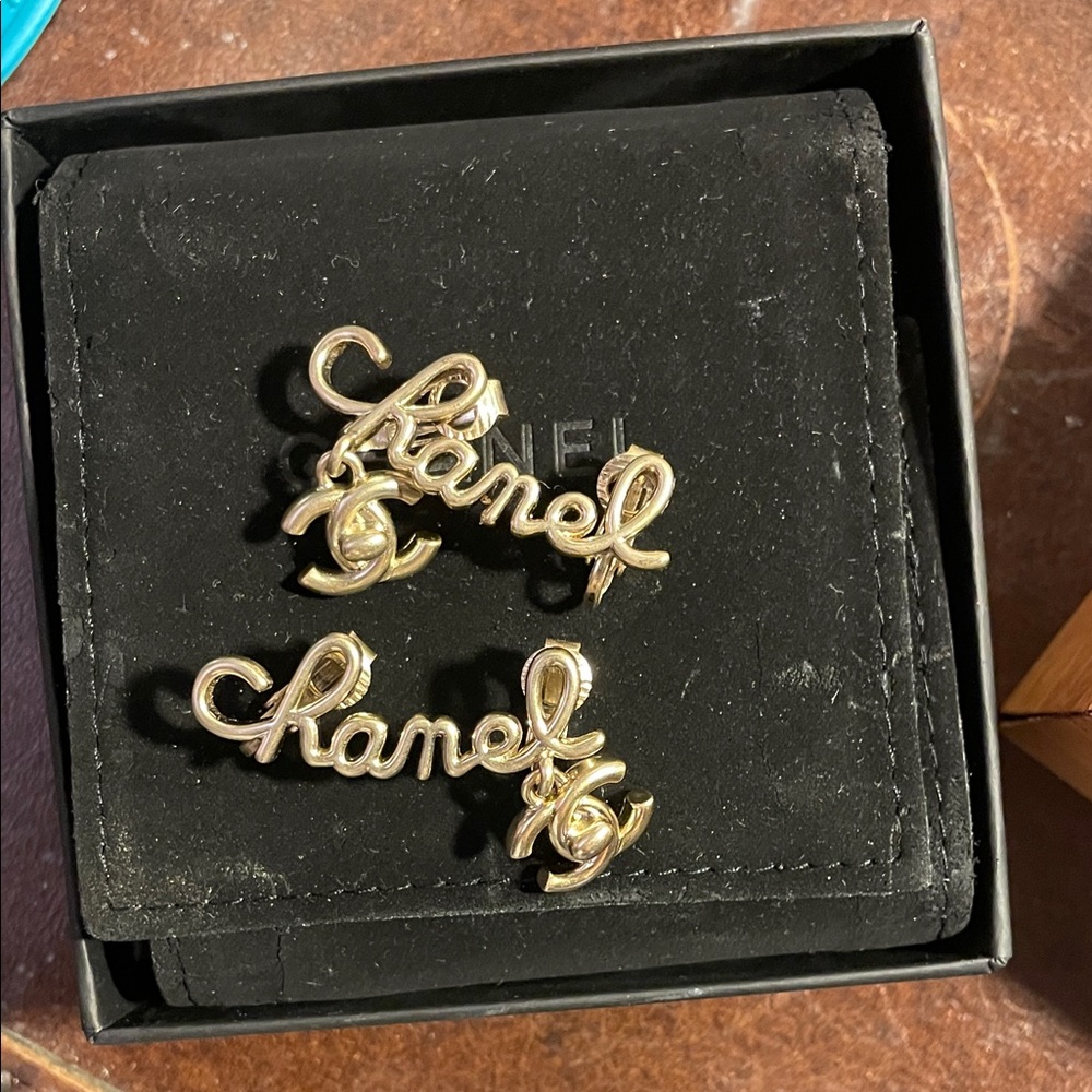 CHANEL Gold Script Logo Earrings